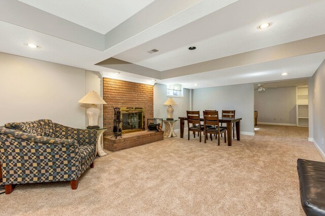 living room with visible vents, baseboards, recessed lighting, a fireplace, and carpet flooring