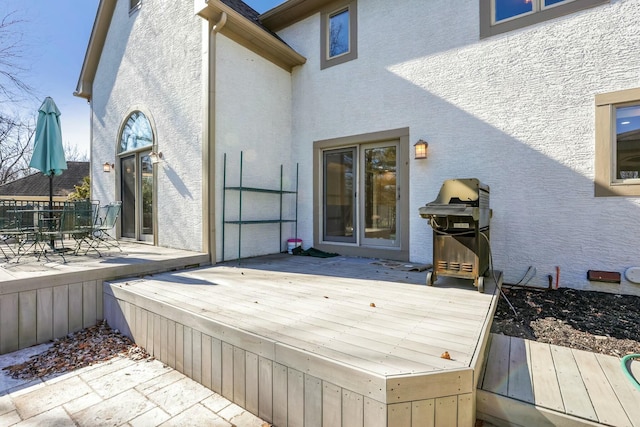 wooden deck with area for grilling