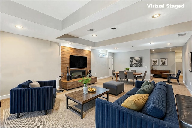 living area featuring recessed lighting, baseboards, and visible vents