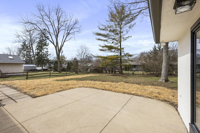 view of yard featuring a patio and fence