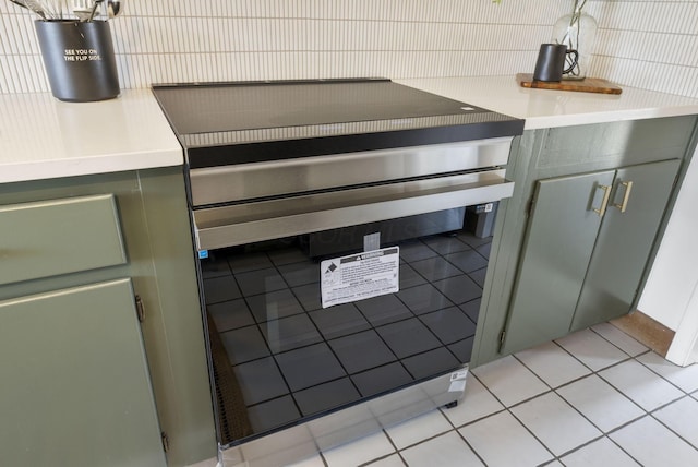 kitchen with light tile patterned floors, wine cooler, and light countertops