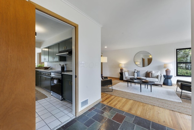 living room with baseboards, visible vents, dark wood finished floors, crown molding, and recessed lighting