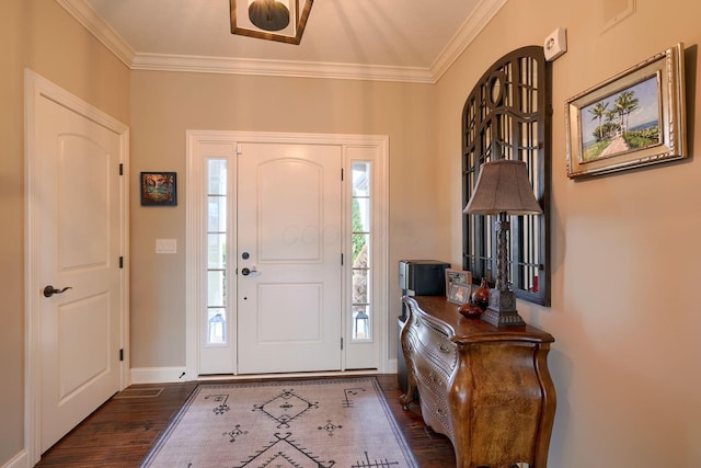 entryway featuring ornamental molding, dark wood finished floors, and baseboards