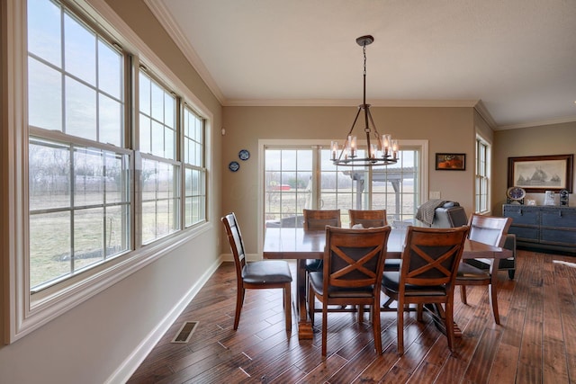 dining room with baseboards, visible vents, dark wood-style floors, ornamental molding, and a notable chandelier