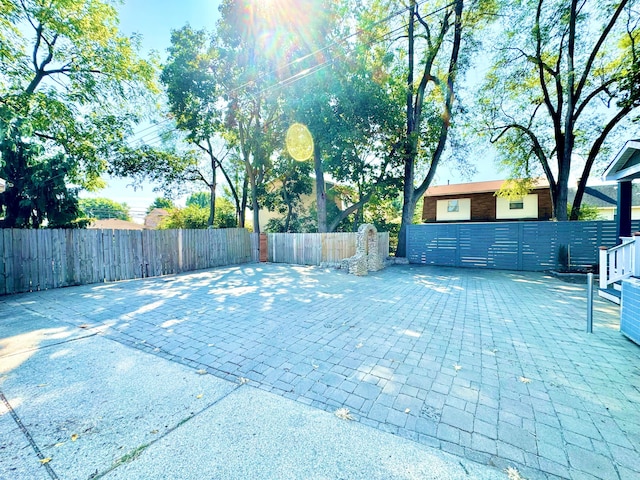 view of patio featuring fence