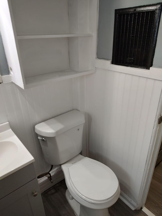 74 W Moler St, Columbus, OH 43207 - half bath with toilet, wood finished floors, and vanity