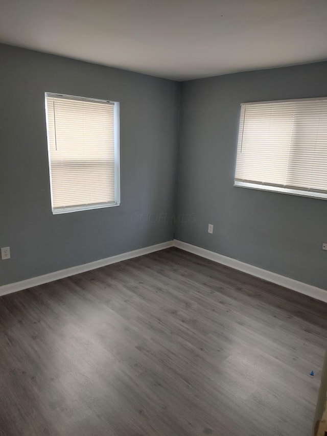 74 W Moler St, Columbus, OH 43207 - empty room with baseboards and dark wood finished floors