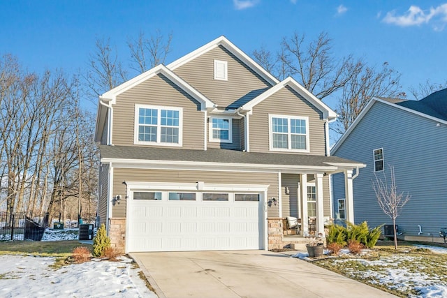 view of front of house featuring a porch, stone siding, an attached garage, and concrete driveway