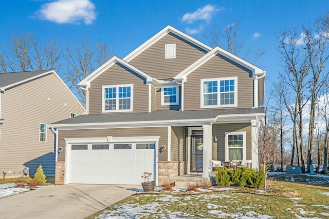 traditional-style home with a garage, stone siding, a porch, and driveway