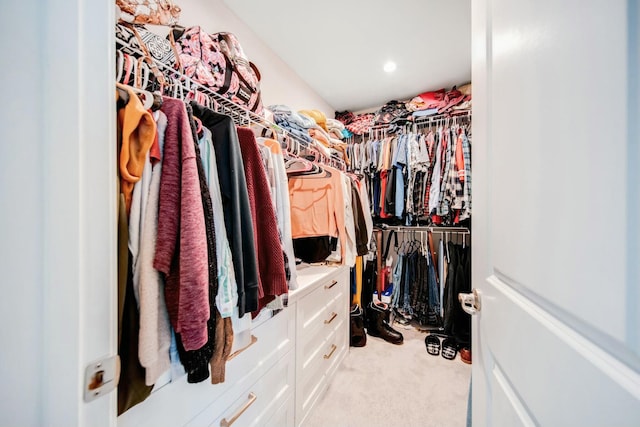 walk in closet featuring carpet floors