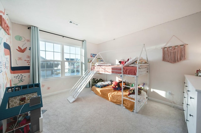 bedroom featuring carpet, visible vents, and baseboards