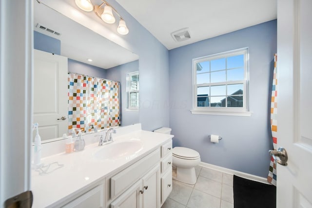 full bathroom featuring toilet, tile patterned flooring, visible vents, and baseboards