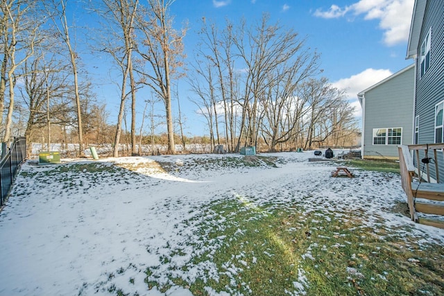 view of yard covered in snow