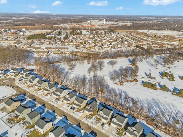 snowy aerial view featuring a residential view