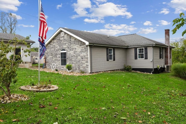 view of home's exterior with stone siding, central AC, a lawn, and a chimney