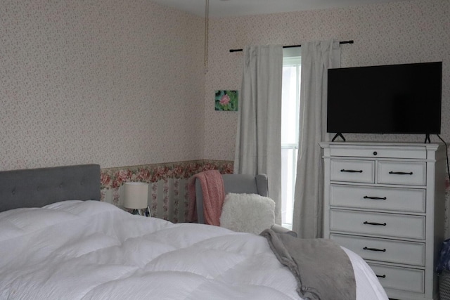 bedroom featuring wallpapered walls