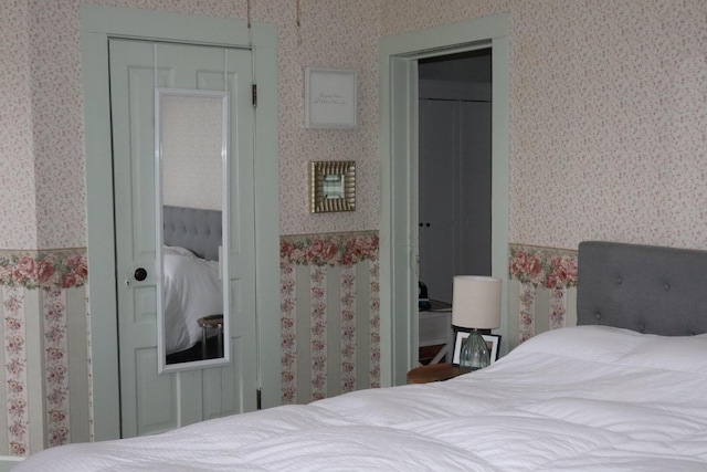 bedroom featuring wallpapered walls