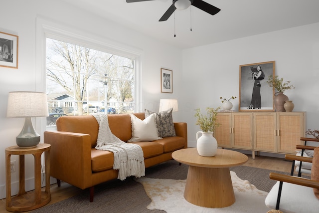 sitting room featuring light wood-style floors and a ceiling fan