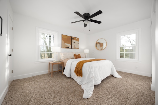 bedroom featuring ceiling fan, baseboards, and carpet flooring