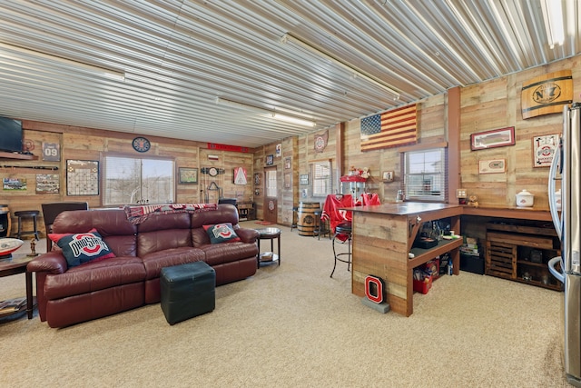 carpeted living room featuring plenty of natural light