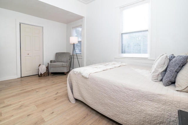 bedroom with wood finished floors