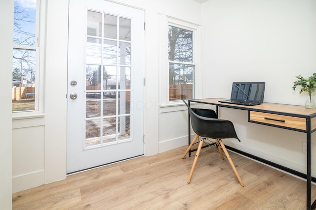 home office with wood finished floors