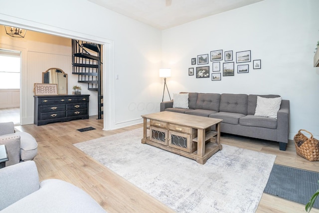 living room featuring light wood-style floors and baseboards