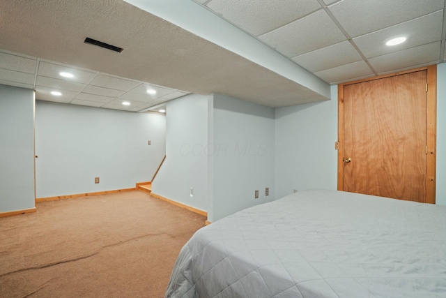 bedroom with recessed lighting, carpet, a drop ceiling, and baseboards