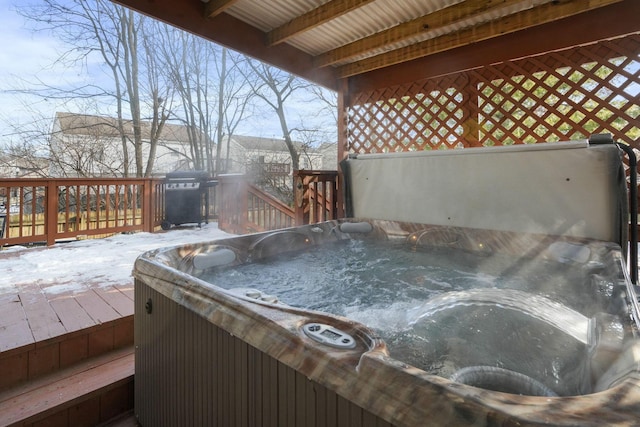 wooden terrace with a hot tub