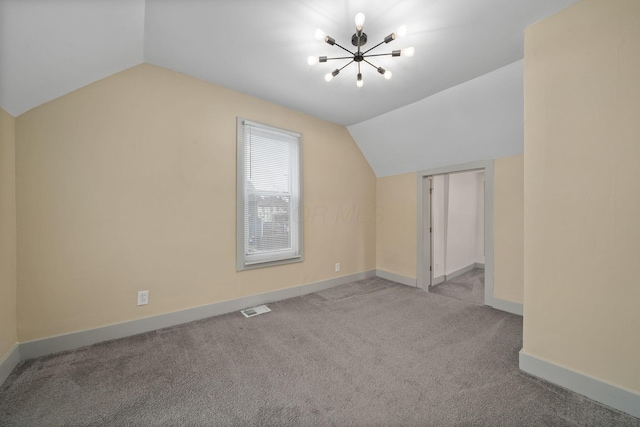 additional living space with carpet, visible vents, vaulted ceiling, a chandelier, and baseboards