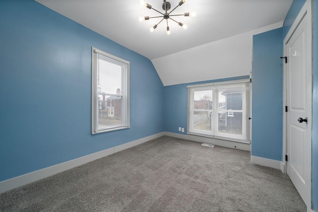 bonus room featuring vaulted ceiling, plenty of natural light, carpet flooring, and baseboards