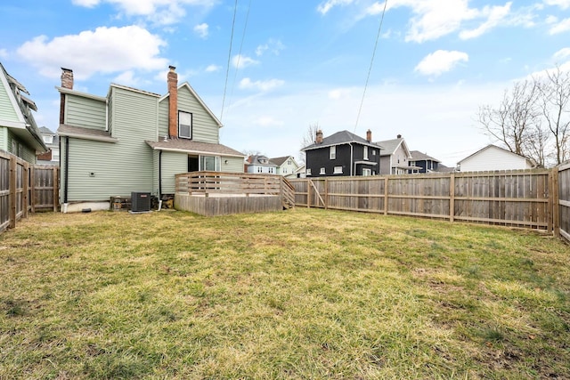 view of yard with cooling unit and a fenced backyard