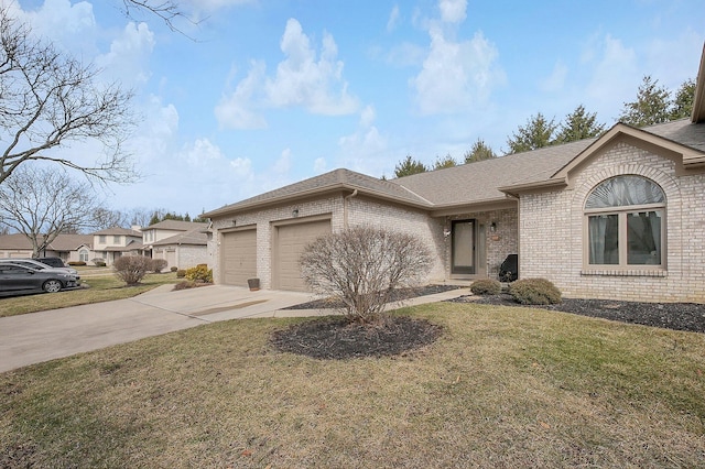 view of front of property with a garage, a front yard, concrete driveway, and brick siding