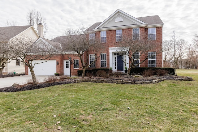 view of front of home featuring an attached garage, a front lawn, and brick siding