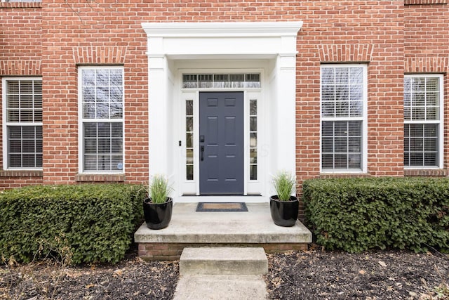 entrance to property with brick siding