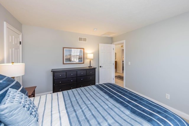 bedroom with visible vents and baseboards