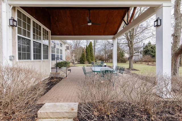 view of patio / terrace featuring a ceiling fan and outdoor dining space