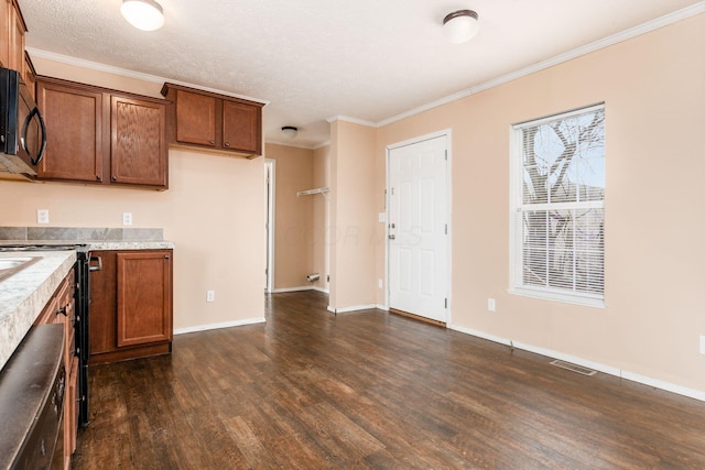 kitchen featuring visible vents, black microwave, dark wood finished floors, and ornamental molding