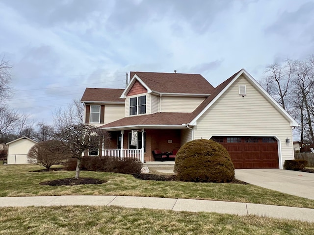 traditional-style home with covered porch, a garage, concrete driveway, roof with shingles, and a front yard