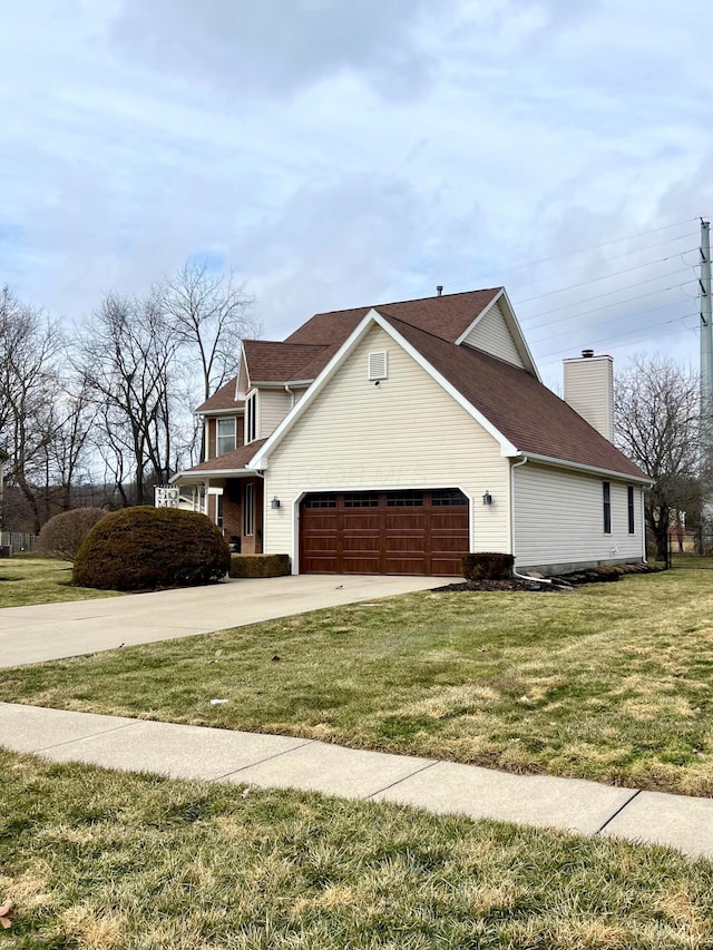 view of property exterior with a garage, driveway, a chimney, and a lawn