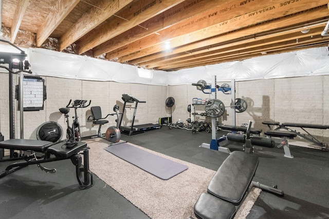 workout area with brick wall