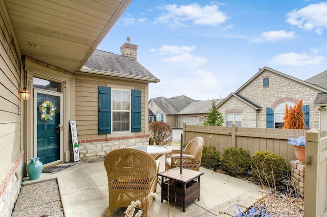 view of patio featuring fence