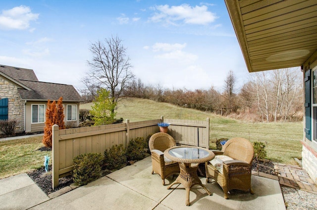 view of patio / terrace featuring fence