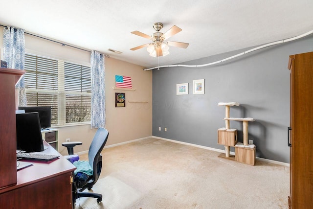 home office featuring carpet floors, visible vents, baseboards, and a ceiling fan