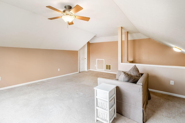 unfurnished room featuring baseboards, visible vents, lofted ceiling, ceiling fan, and carpet floors