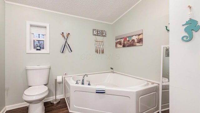 bathroom with crown molding, toilet, a textured ceiling, wood finished floors, and a bath