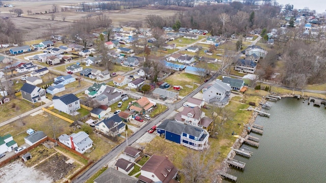 birds eye view of property featuring a residential view and a water view