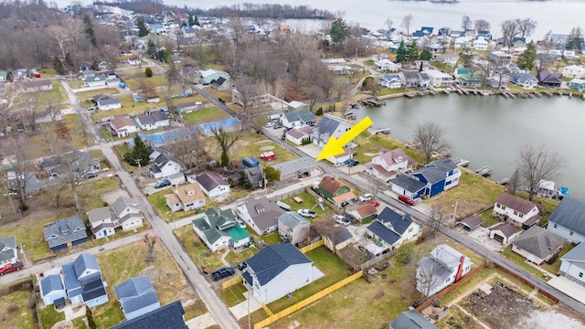 bird's eye view featuring a water view and a residential view