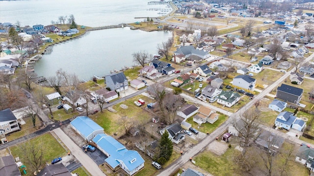 bird's eye view featuring a water view and a residential view