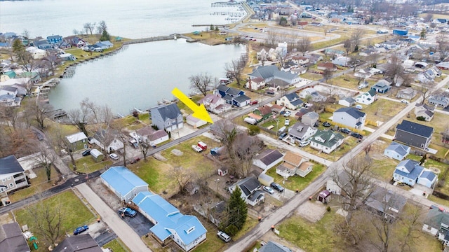 bird's eye view with a water view and a residential view